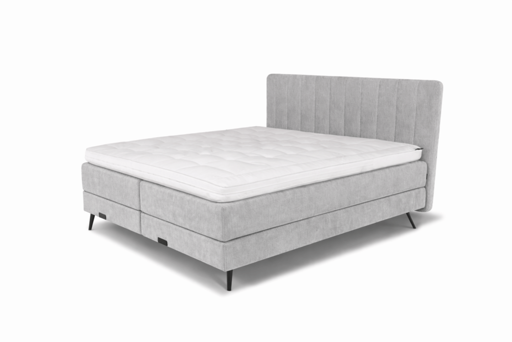De complete Caresse 3400 Elektrisch boxspring met gestoffeerd hoofdbord in banen.